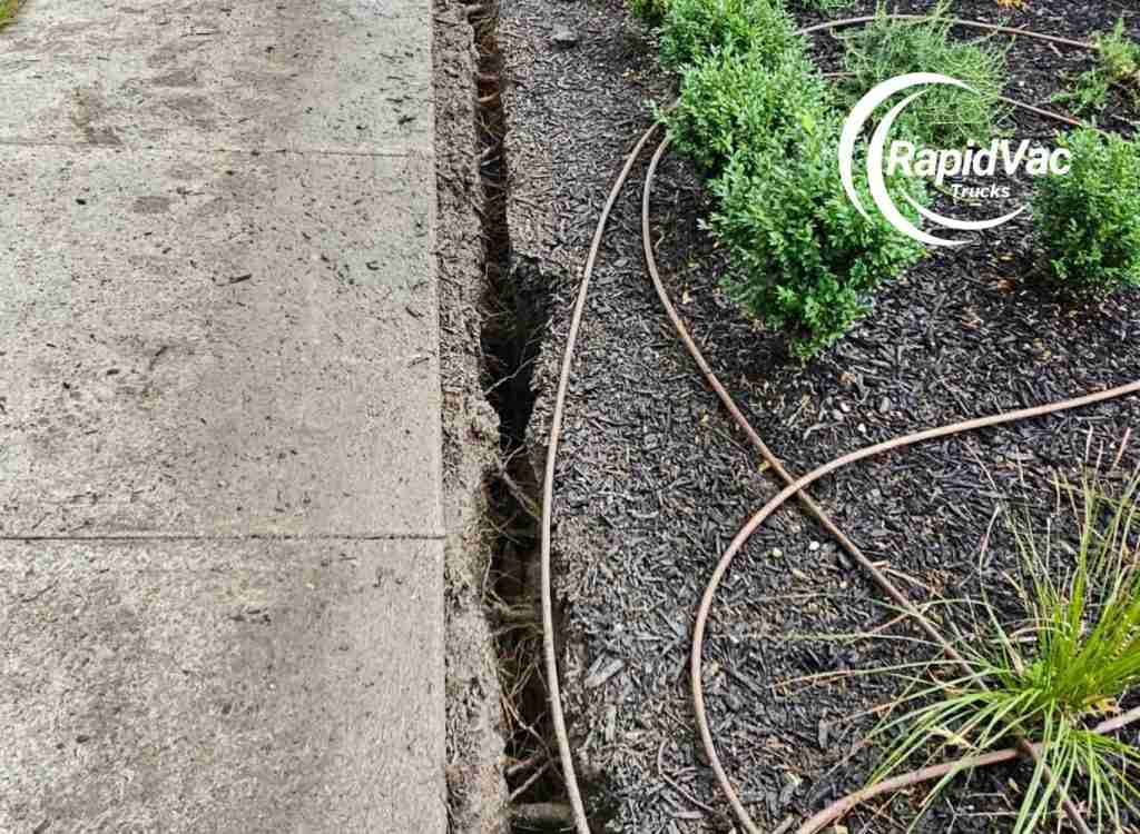 Vac truck service creating trenches for pipeline installation.